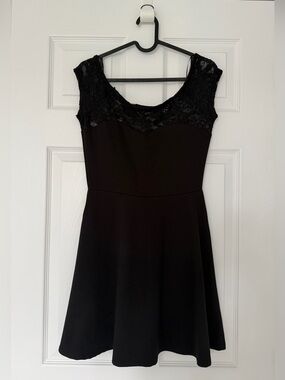 Mini black dress with lace neckline